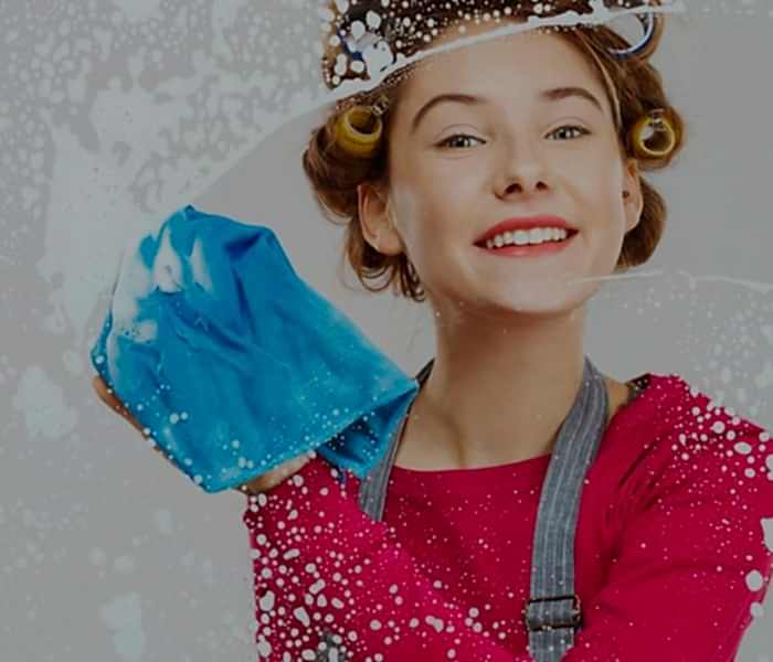 portrait attractive blond cleaning lady with crossed arms